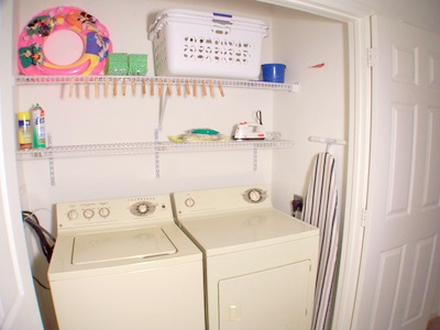 Washer and dryer in entry foyer of K's Butterfly at Windsor Palms Resort