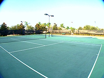 Tennis courts with clubhouse in background