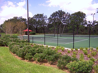 Tennis courts next to K's Crystal at Emerald Island Resort