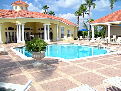 Swimming pool area with Tiki bar at clubhouse 